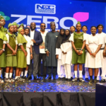 Students flank Idris Olorunnimbe, Chairman of the Board of the Nigerian Communications Commission; Don Jazzy; and Dr. Aminu Maida, Executive Vice Chairman/CEO of the NCC, during the unveiling of the Zero-Rated Data Access to Educational Platforms and Content Initiative aimed at promoting inclusive digital education through free access to approved learning platforms.