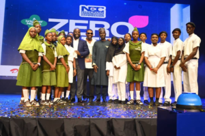Students flank Idris Olorunnimbe, Chairman of the Board of the Nigerian Communications Commission; Don Jazzy; and Dr. Aminu Maida, Executive Vice Chairman/CEO of the NCC, during the unveiling of the Zero-Rated Data Access to Educational Platforms and Content Initiative aimed at promoting inclusive digital education through free access to approved learning platforms.